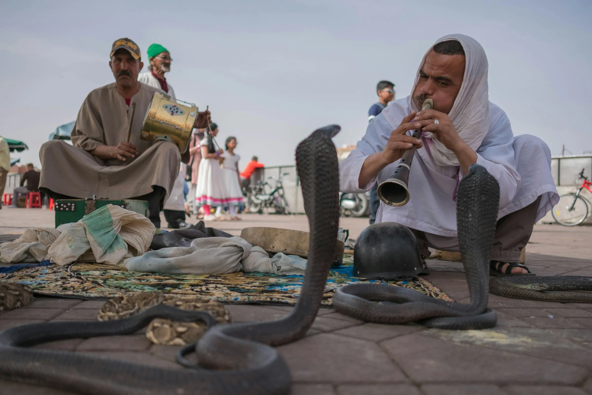 Circle of spectators around a storyteller on Jemaa el-Fna square