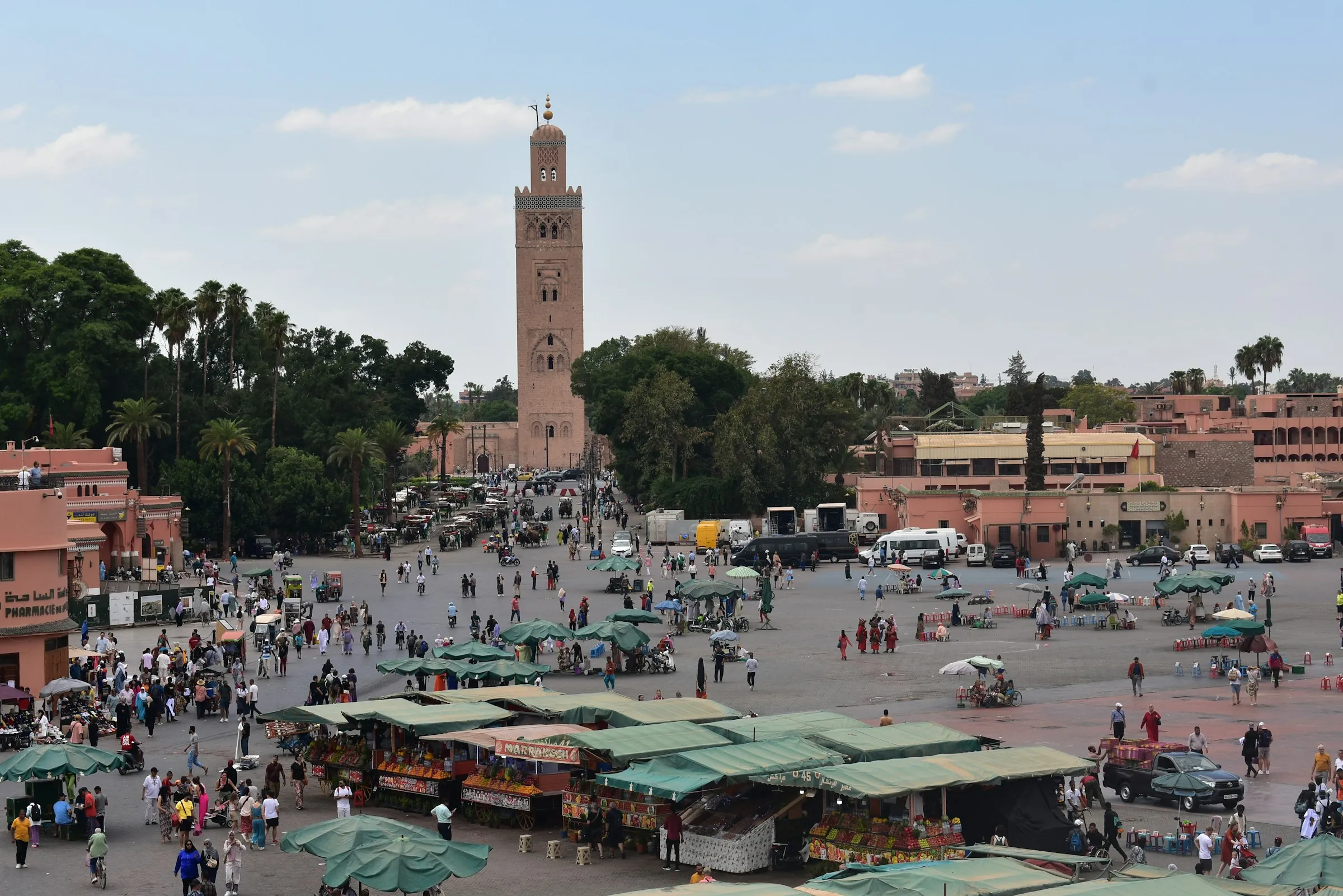Evening crowd on Jemaa el-Fna Square with the Koutoubia mosque in the background